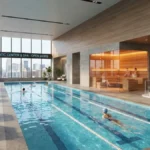 Gyms with Pools, Gyms with Pools near me, Swimming Pools, Gym Amenities, Saunas, Hot Tubs, LA Fitness, Life Time, Recovery, Gyms with Pools, Indoor swimming pool at LA Fitness, luxury gym sauna with glass door, hot tub jets bubbling, person swimming laps in gym pool, Life Time outdoor pool slide